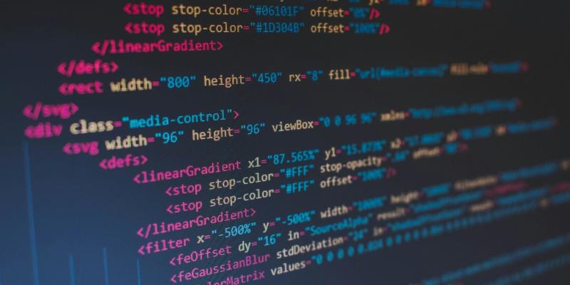 Several lines of code written in multi-colored font against a dark background.